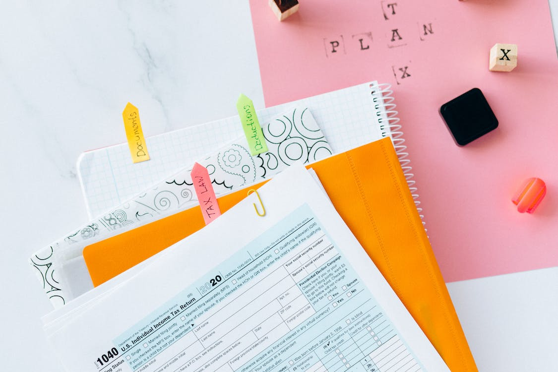 tax return form and notebooks on the table