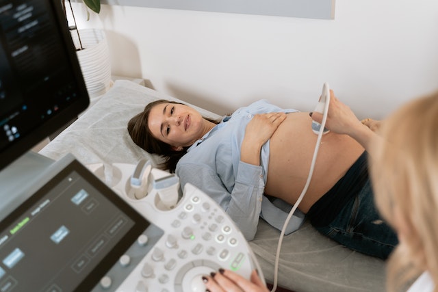 Sonographer performing a scan.
