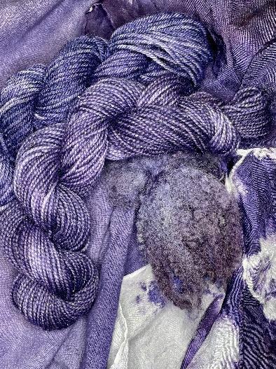 A close up of a purple yarn
Description automatically generated