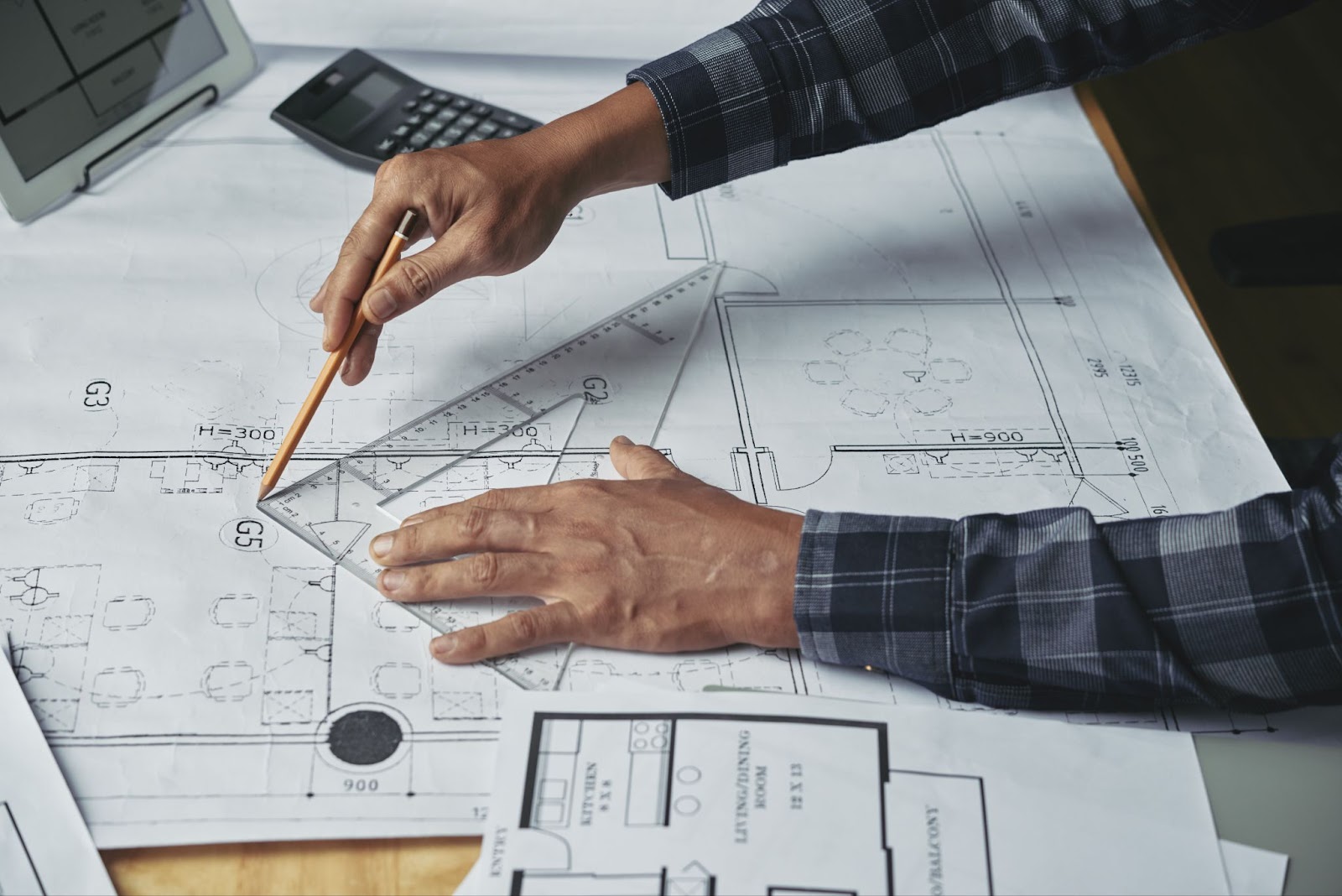 Close-up of a businessman working on a construction plan.