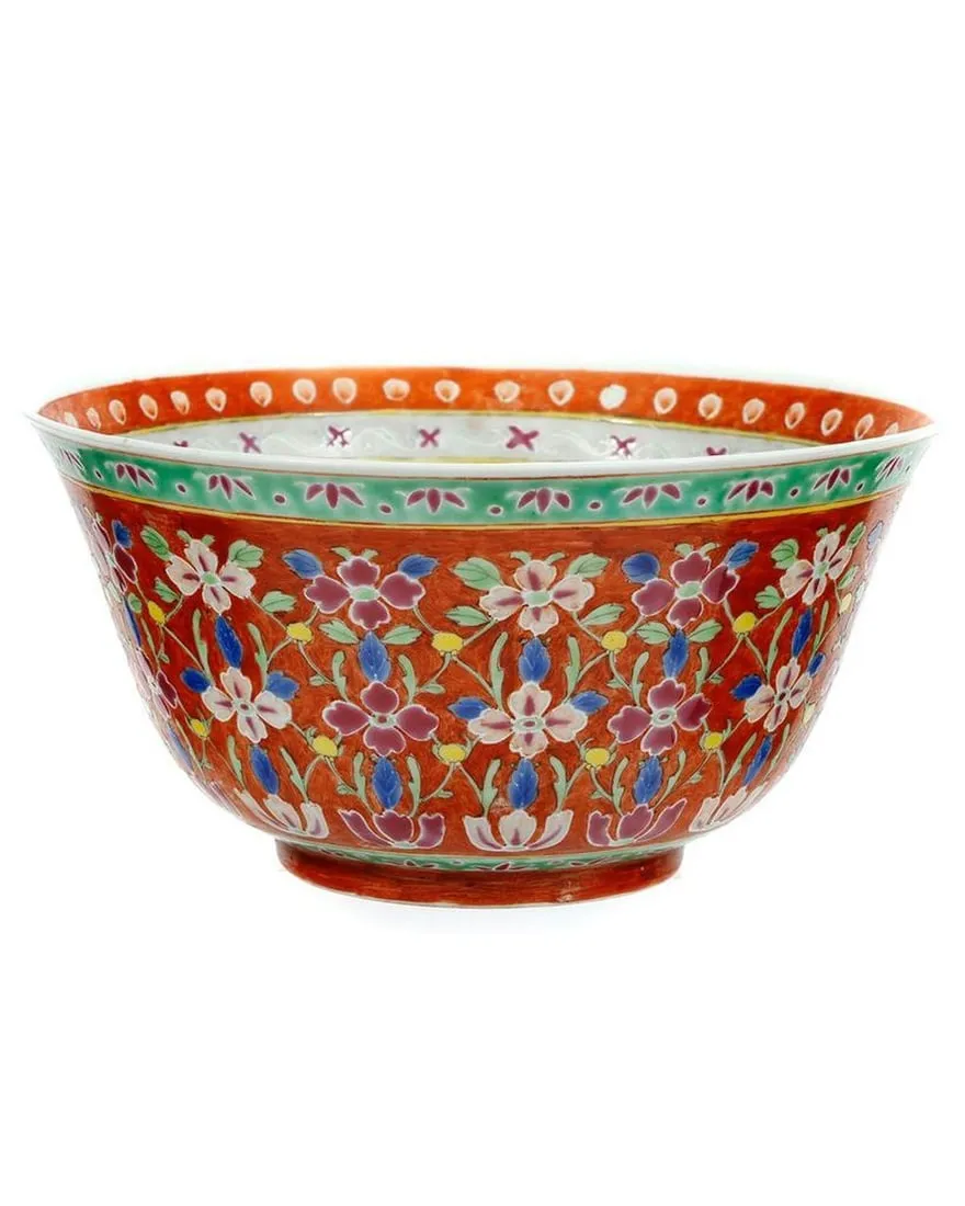 A colorful bowl with flowers on itDescription automatically generated