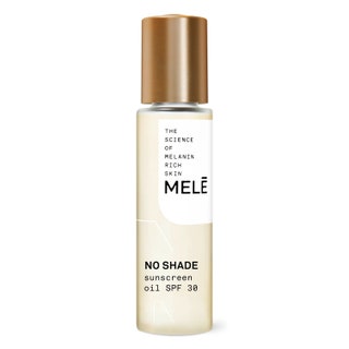 A clear bottle of Melé No Shade Sunscreen Oil on white background