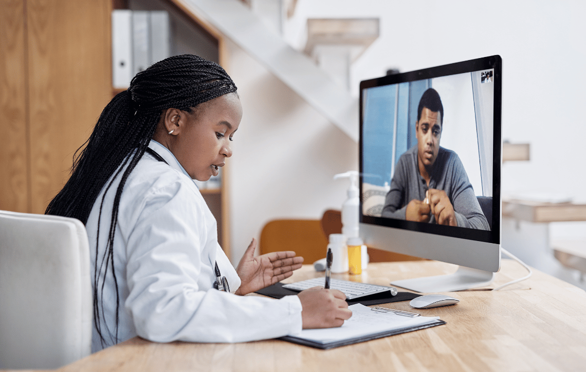 Doctor with a client over virtual meeting