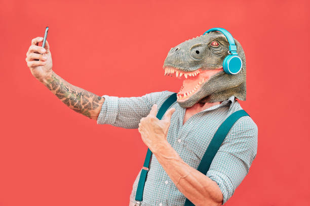Man in T-Rex Mssk Taking Selfie