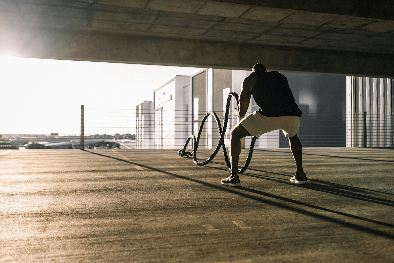 A man working out outside using jumps - https://unsplash.com/photos/man-in-black-t-shirt-and-white-shorts-walking-on-brown-wooden-floor-eGSBVVtVCCw