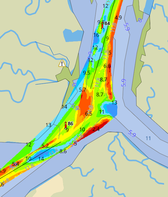 A bathymetric map showing shallow water on the inside of a curve.