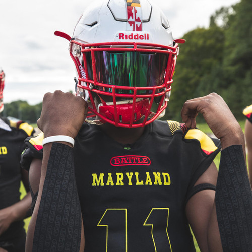 Maryland football player showing black Battle turf tape on the back of his forearms 
