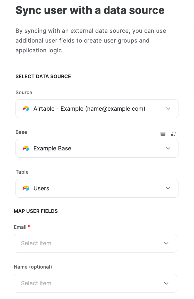 Overview of ‘Sync user with a data source’ menu, with the options to select a data source and to map user fields in Softr to fields in Airtable.