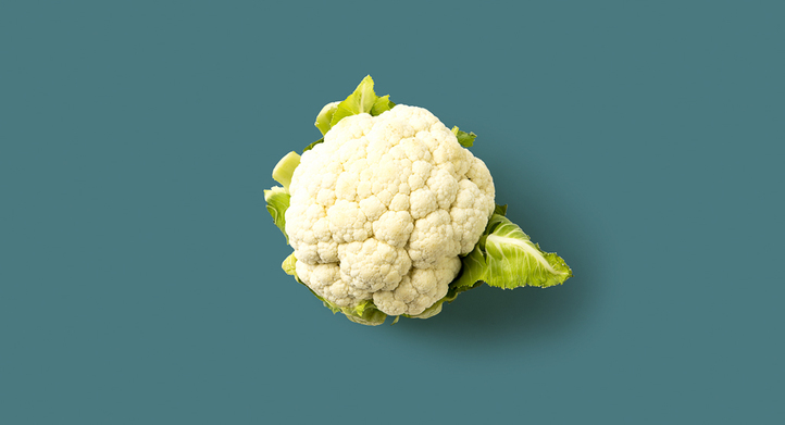 a head of cauliflower on flat surface