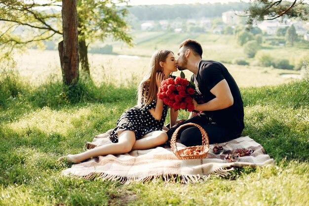 Free photo beautiful couple spend time in a summer field