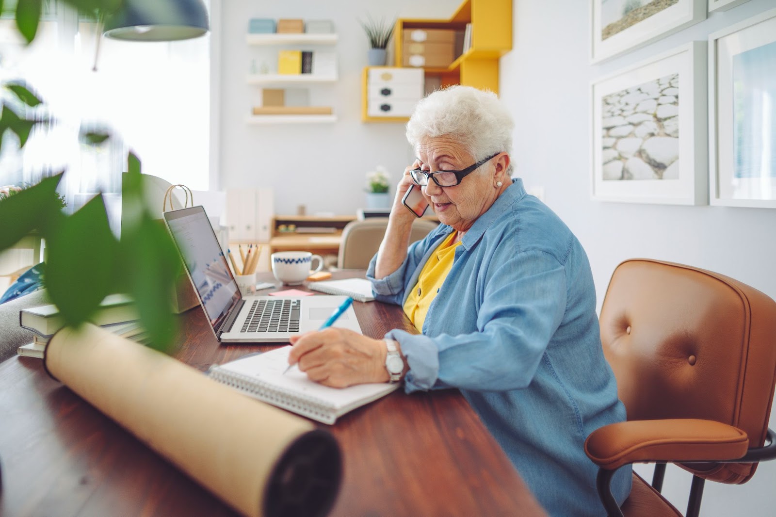 senior lady taking phone calls in office