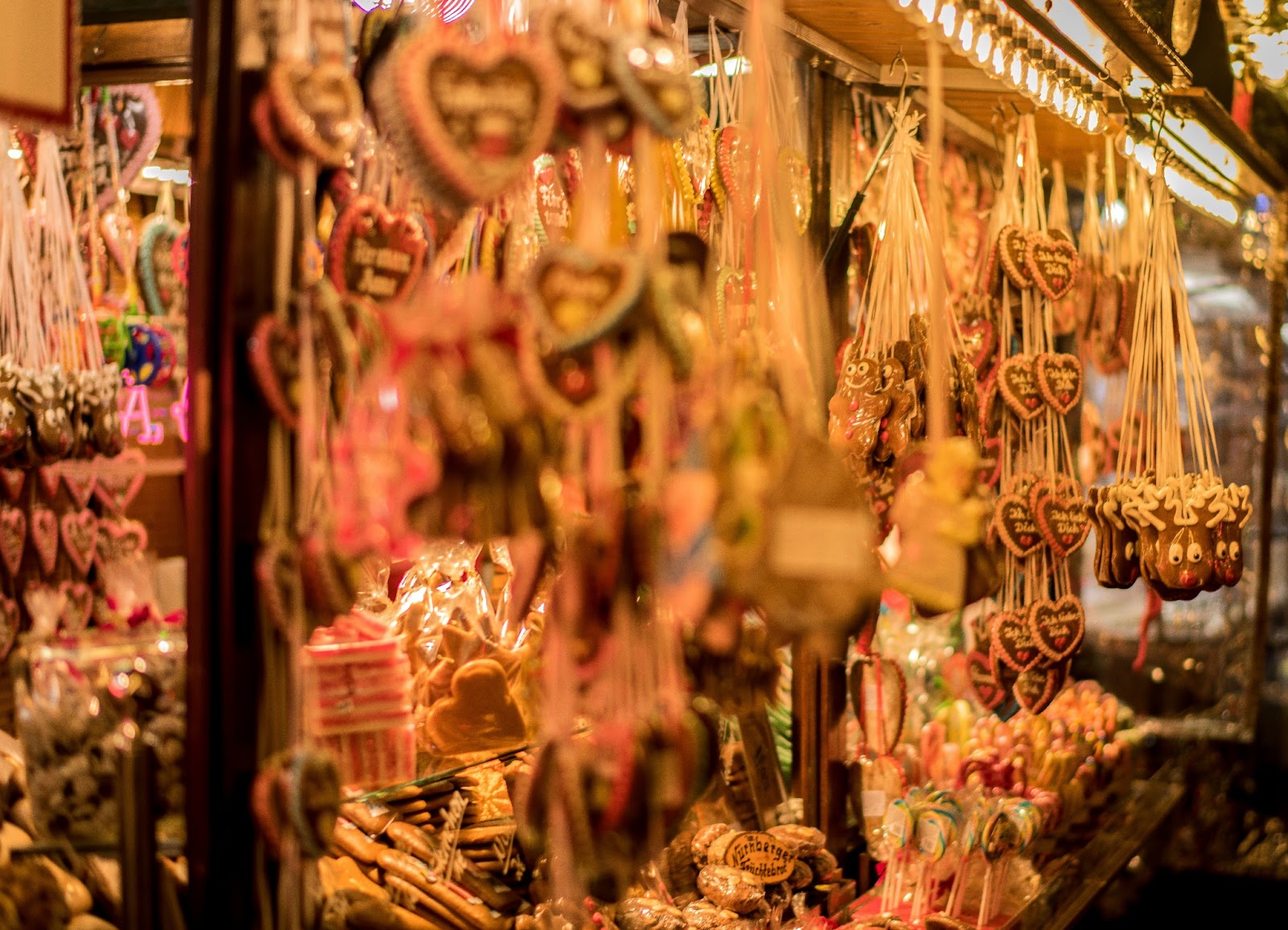 Handcrafted Christmas ornaments displayed on a stall at a European market.