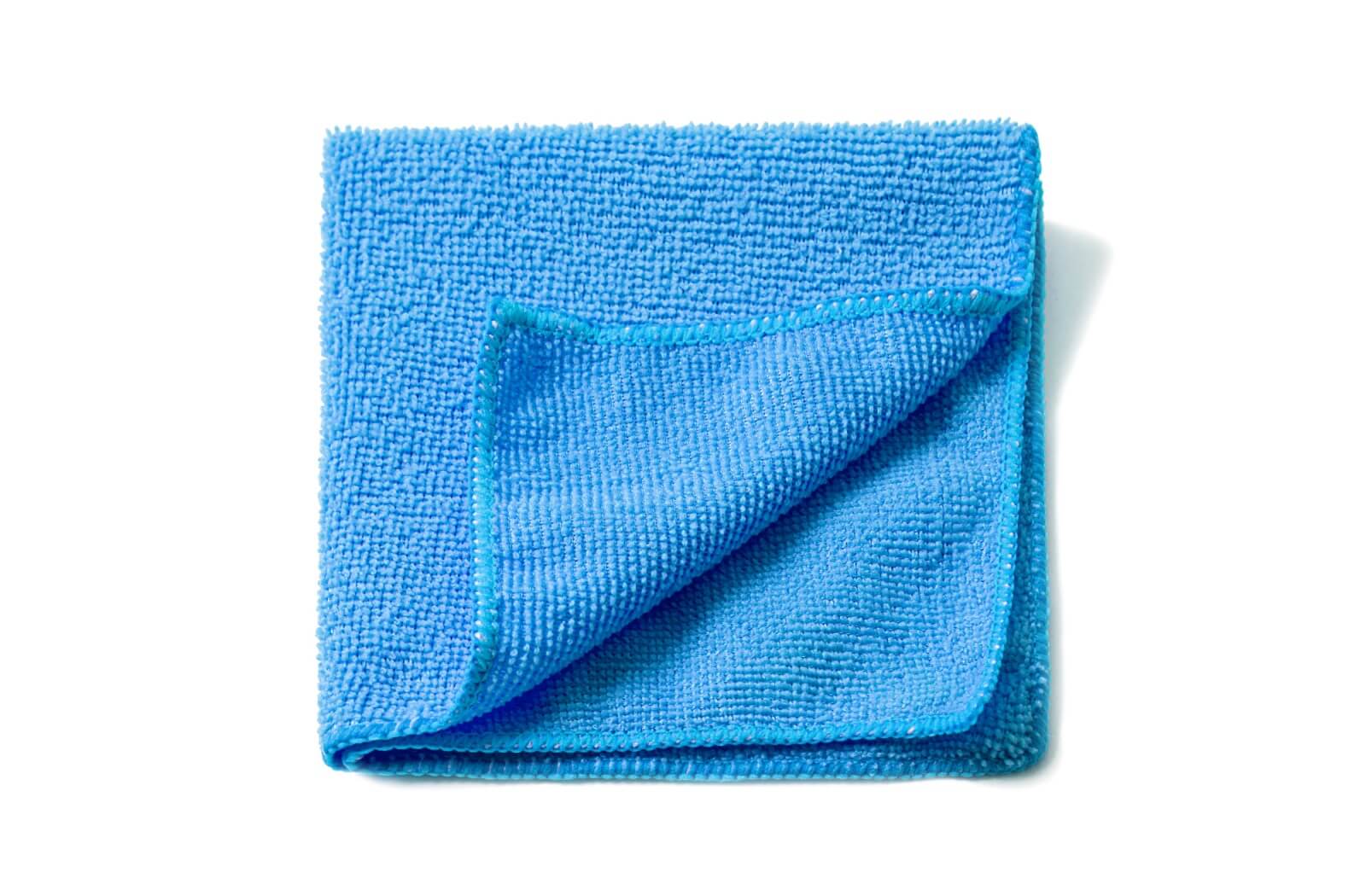 A piece of lint-free microfibre cloth used for cleaning safety glasses against a white background.
