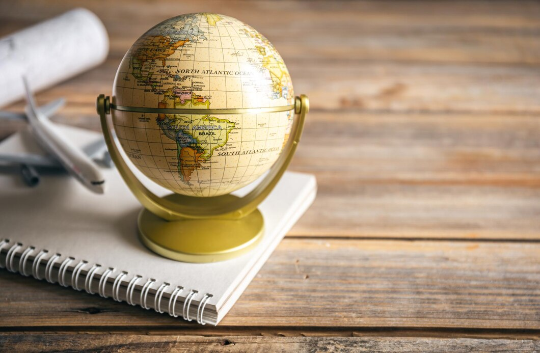 Earth globe on notepad – a symbolic image for A-Level Geography exploration.