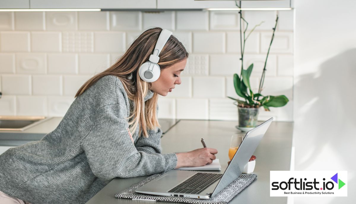 Woman studying online with headphones and digital tablet