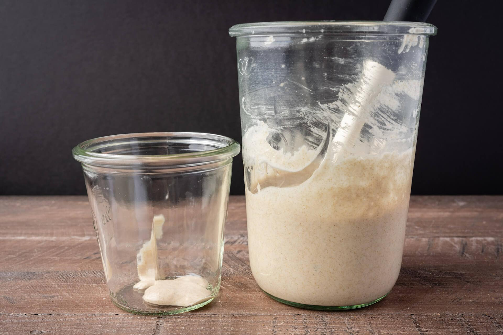 Top 10 Sourdough Starter Tips - smaller sourdough starter next to larger sourdough starter