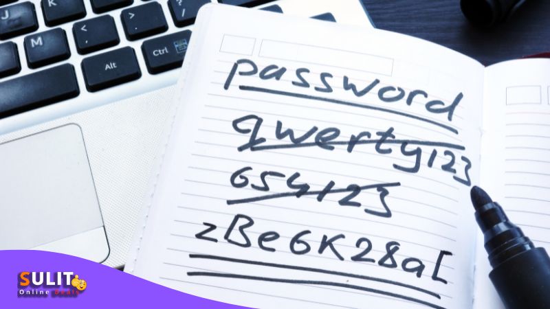 Notepad with "Password" and long string of characters written, next to laptop keyboard, relating to security of online payment methods in the Philippines.