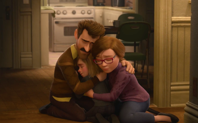 Riley and her parents embrace near the end of the movie "Inside Out"