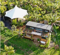 A typical tiny home; prefab and cargo container combined; this located on the southern coast of the Bannon Sea in North America