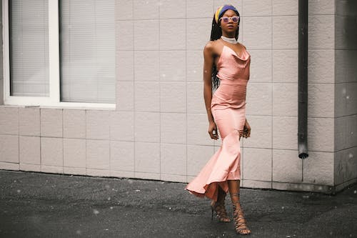 Free Woman Wears Pink Spaghetti-strap Dress Stock Photo