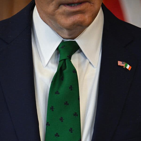 A close-up of a shamrock-themed tie worn by President Biden.