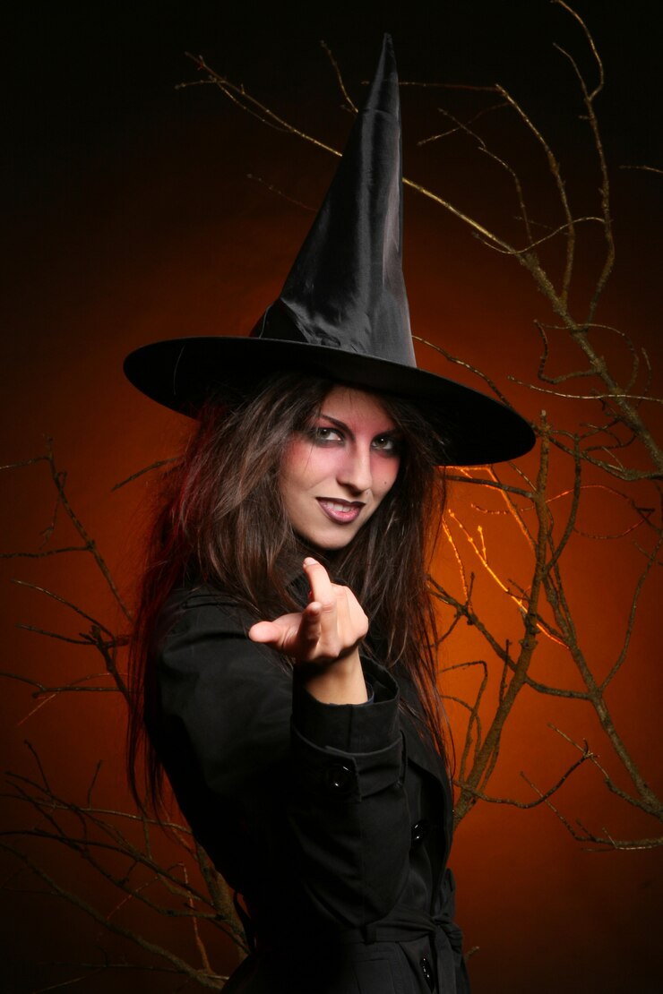 A woman dressed as a witch.