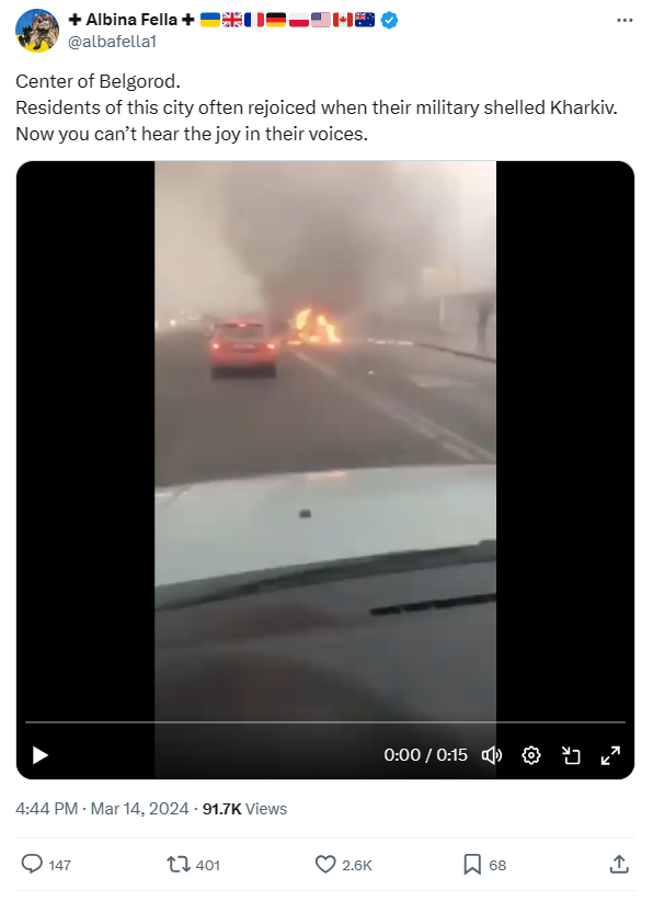 A car on fire on a road

Description automatically generated