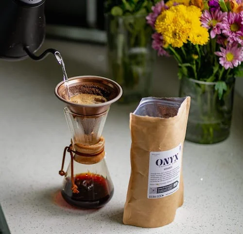 Gourmet Coffee or Tea Set (Pictured: A bag of Onyx coffee with a Pour-over device and flowers in the background)