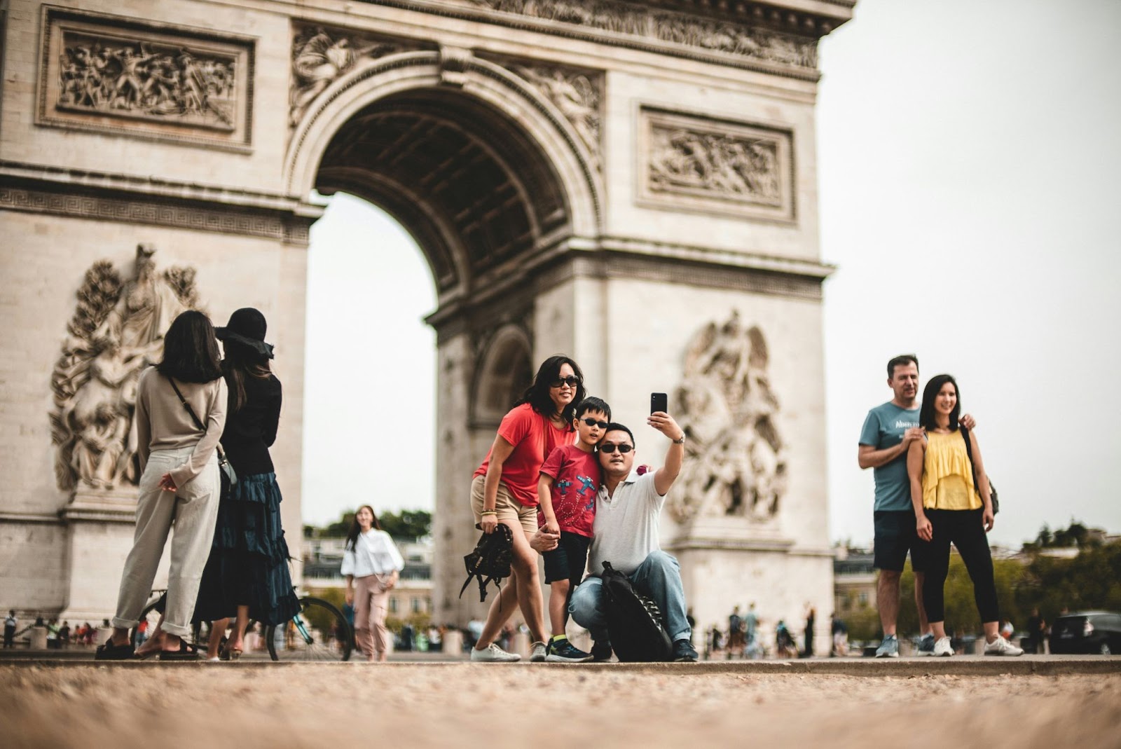 A family in Paris taking the perfect holiday family photo.