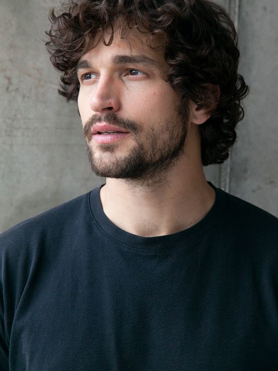 Picture of a man wearing wavy hair 