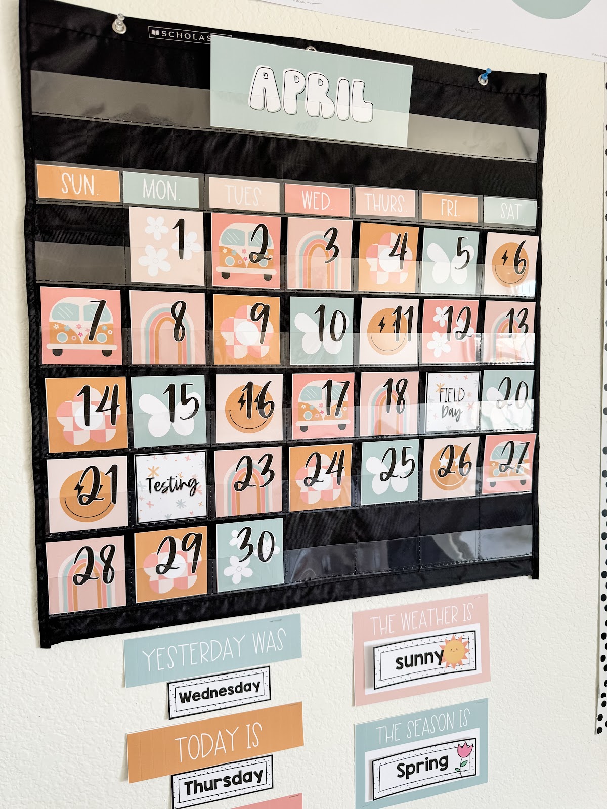 This image shows a calendar display designed with the pastel retro classroom theme. There are weather cards underneath the calendar. 