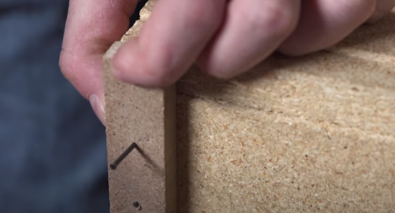 Secure the strip to the backsplash with two nails