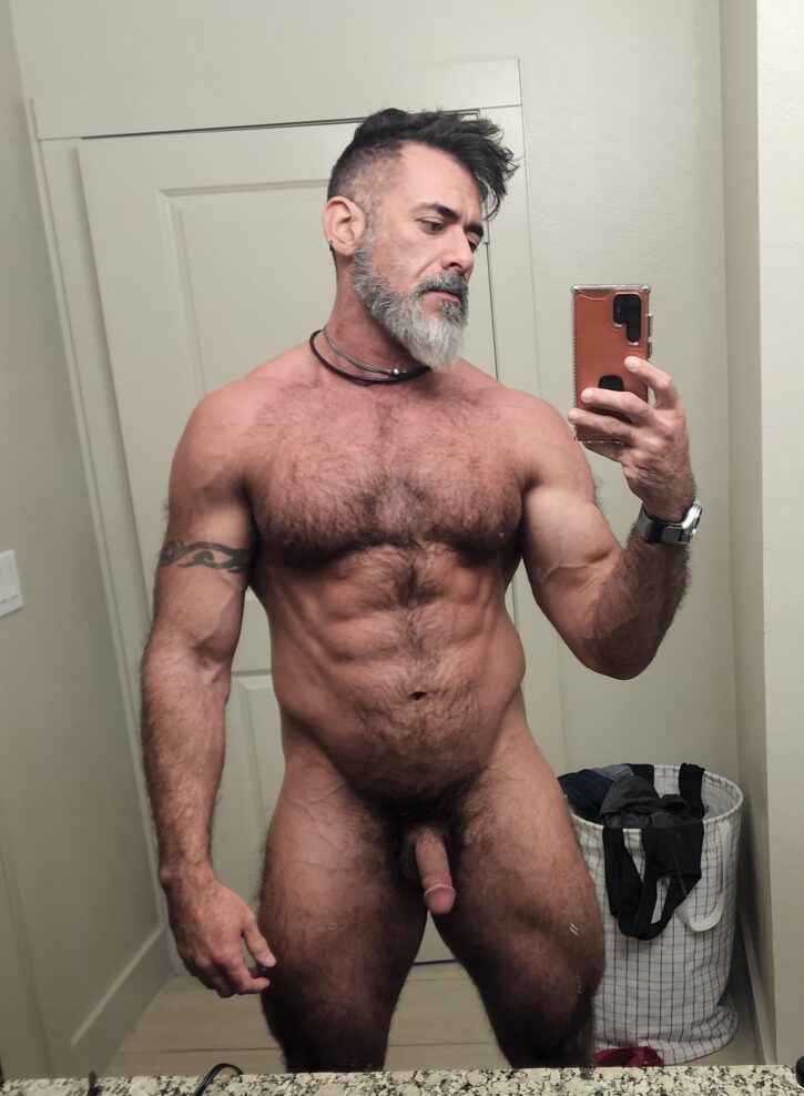 Lawson James posing naked in the bathroom mirror taking an android smartphone selfie 