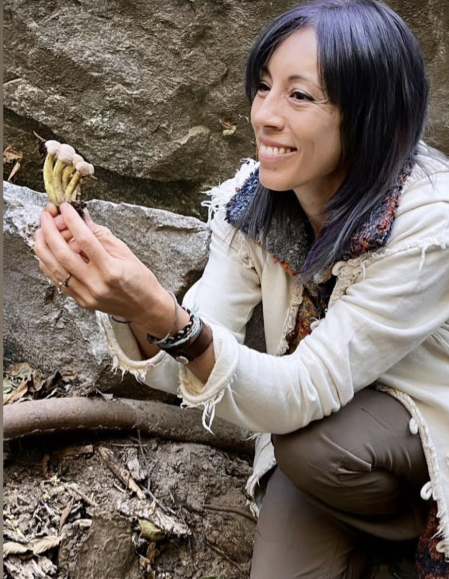 Jess Starwood holding a mushroom