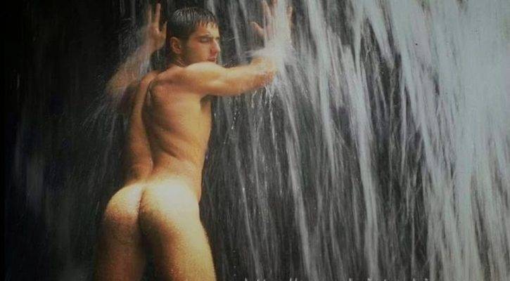 Luciano Pereira naked under a waterfall showing off his hairy ass
