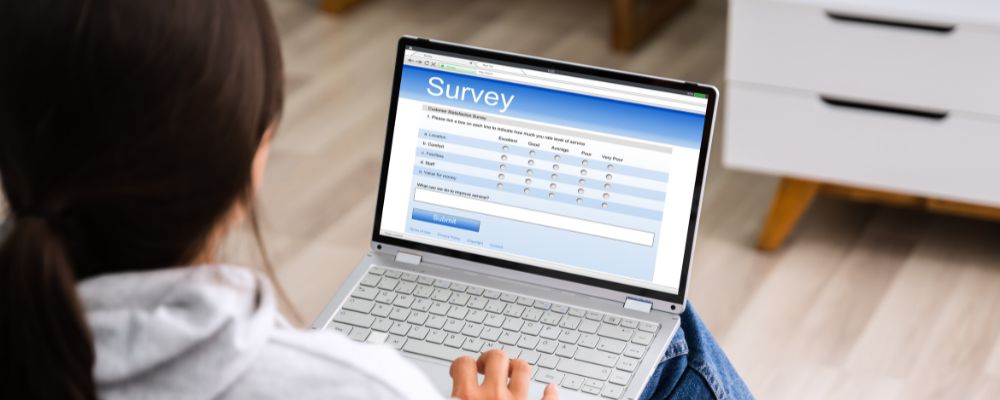 Woman doing online surveys to make some extra money on the side