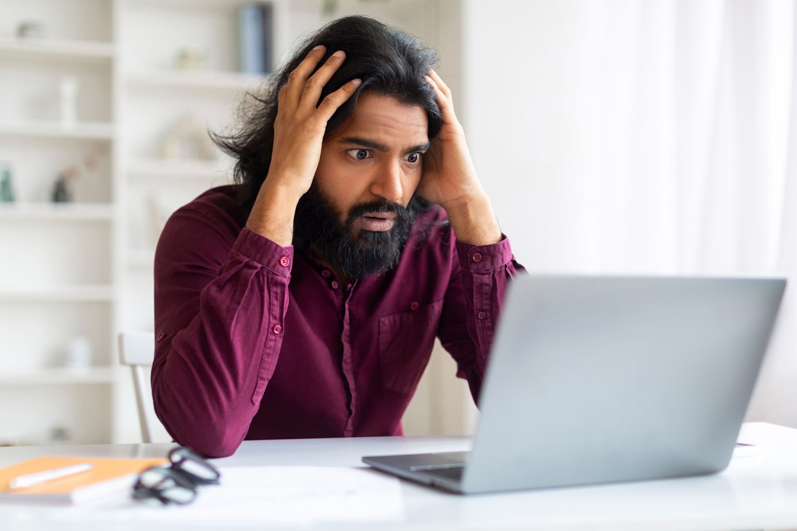 Man stressed at computer about if his IT infrastructure upgrade will protect his data