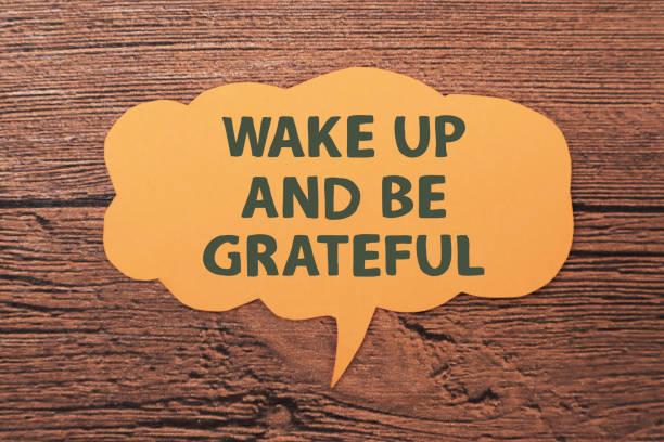 Wake up and be grateful, text words typography written on paper against wooden background, life and business motivational inspirational Wake up and be grateful, text words typography written on paper against wooden background, life and business motivational inspirational concept Grateful Attitude stock pictures, royalty-free photos & images