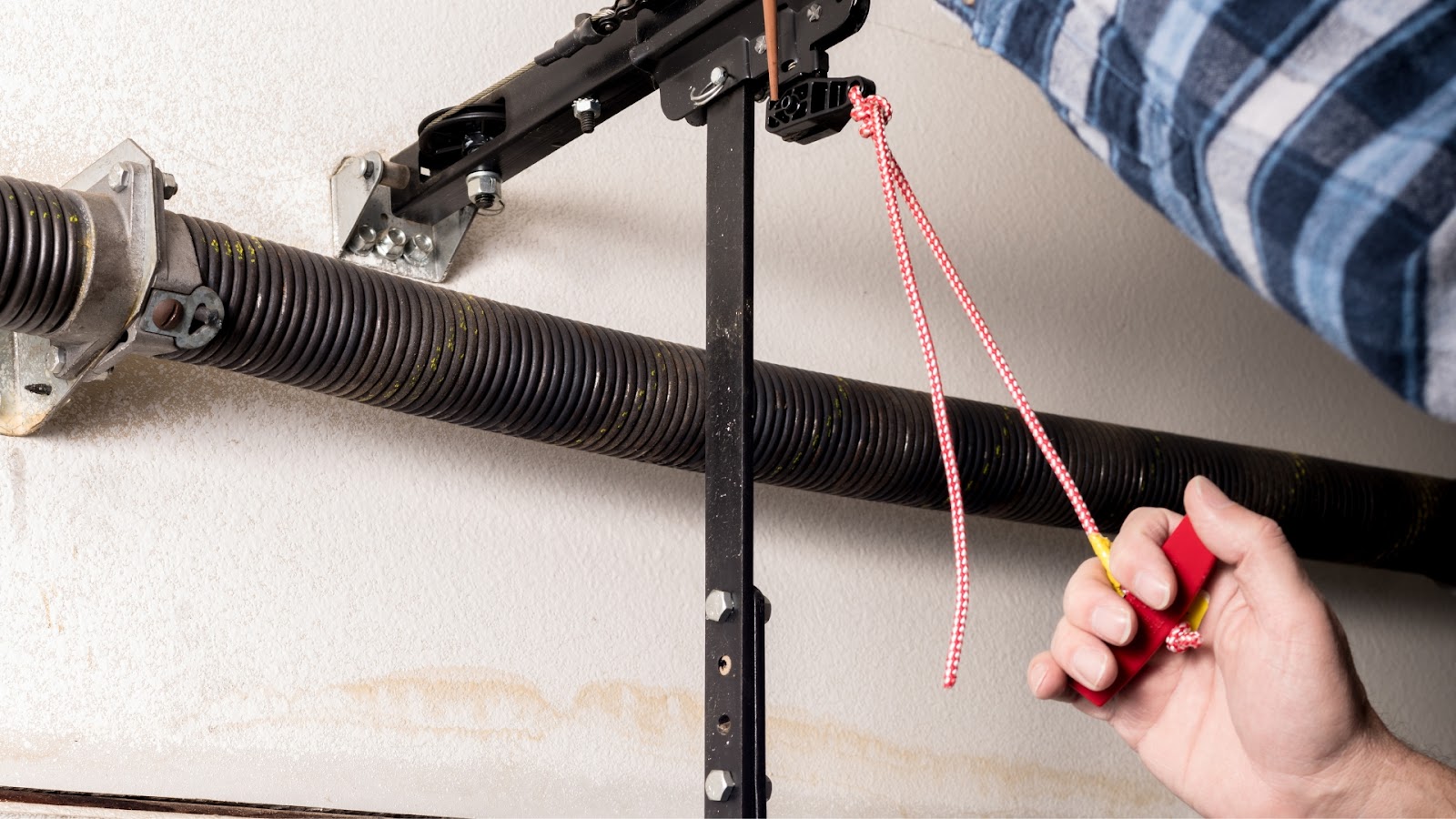A technician fixing a garage door opener