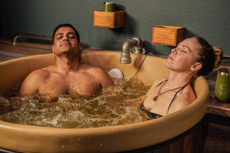 couple relaxing in a beer bath at Oakwell Beer Spa in Denver