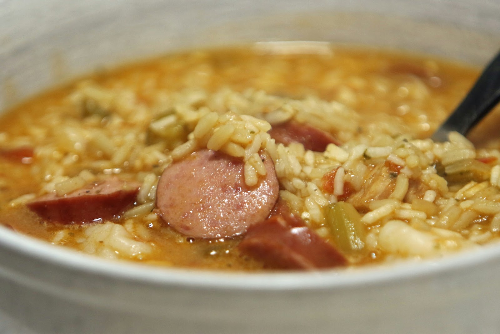 A warm bowl of spicy gumbo fills the air with vibrant fragrances. 