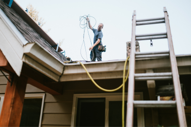 what is a general contractor frequently asked questions remodeler working with wiring on the roof custom built michigan