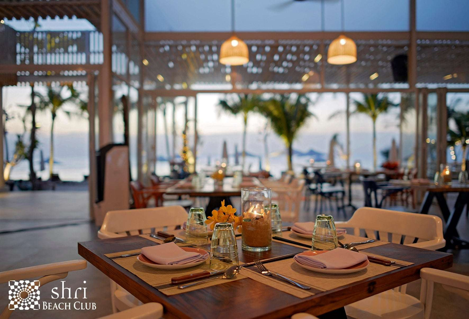 a restaurant with open space to the sea
