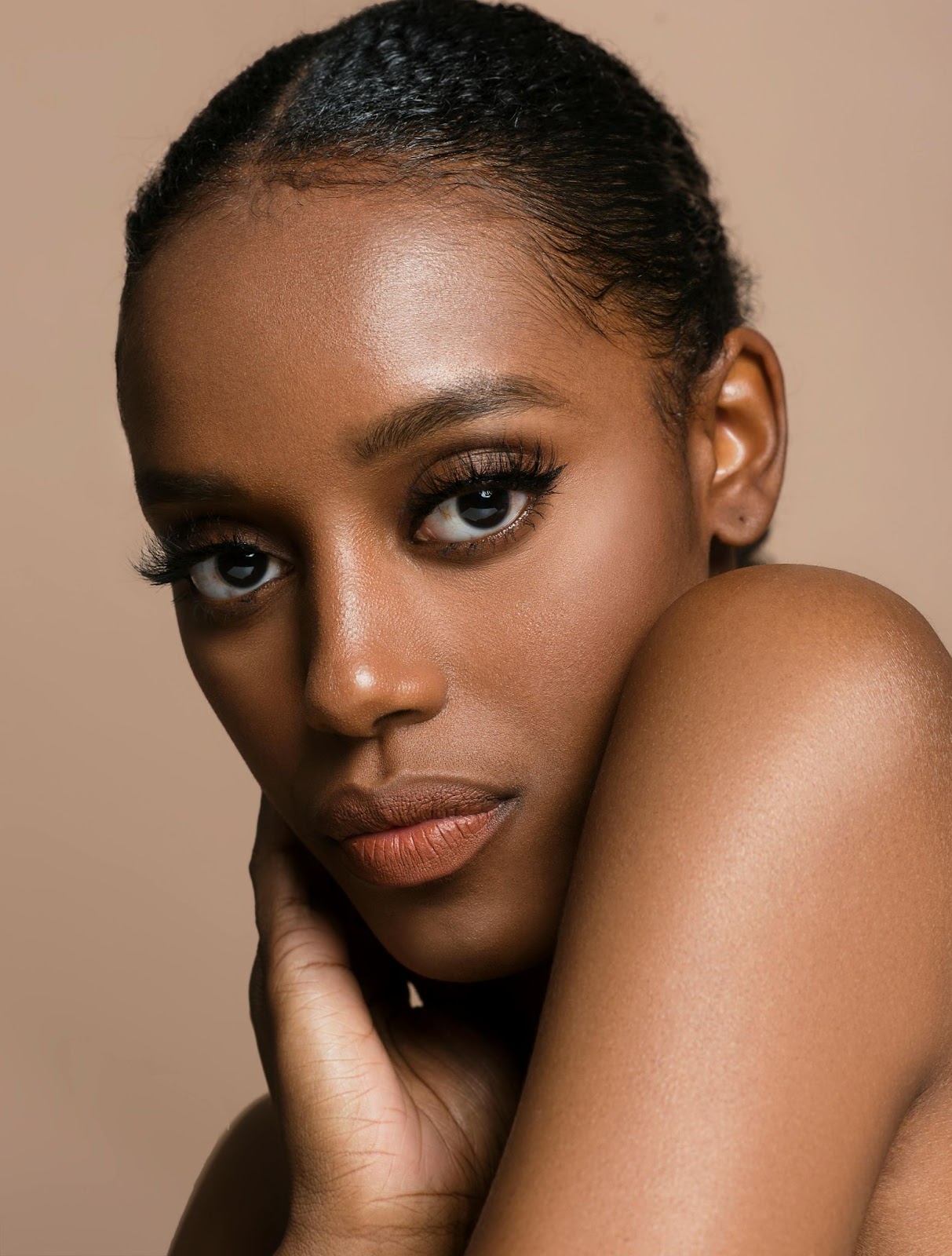black woman with flawless skin by following ayurvedic skin care