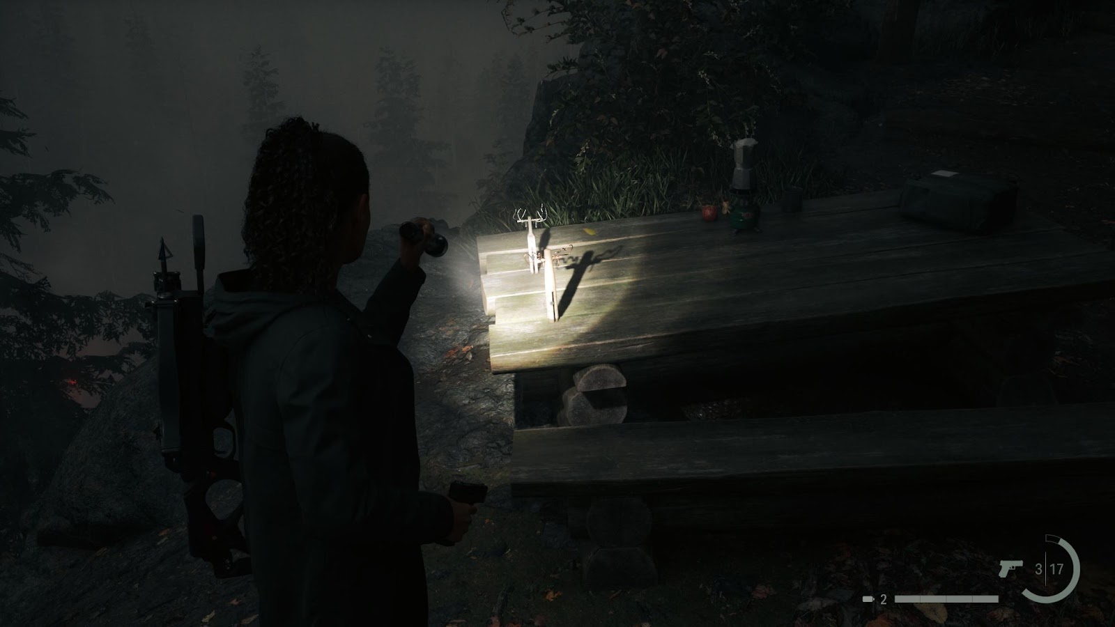 An in game screenshot of the deer doll and the moose doll from the game Alan Wake II. 