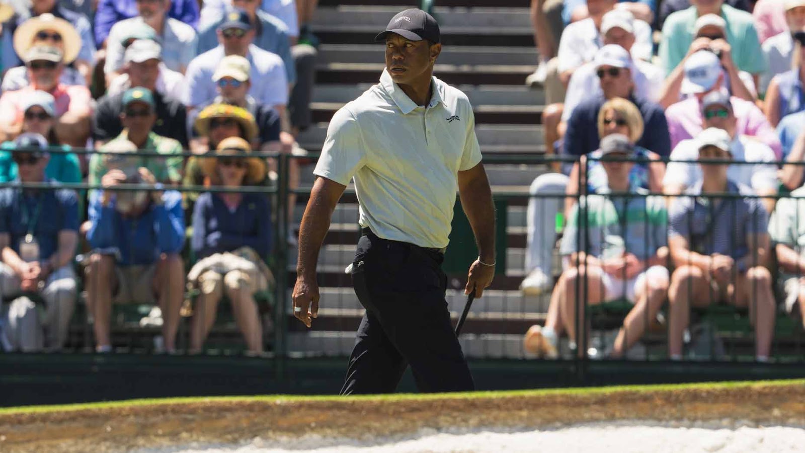 tiger woods walks on a green during the third round of the 2024 masters