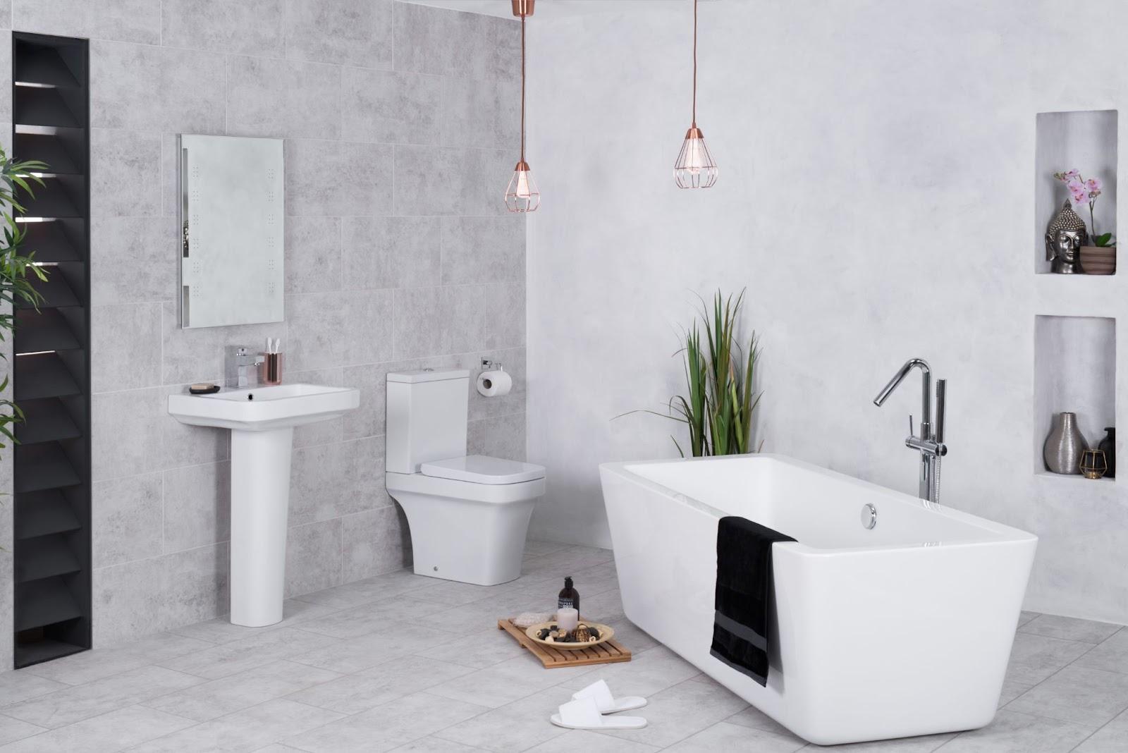 A bathroom with a tub toilet and sinkDescription automatically generated