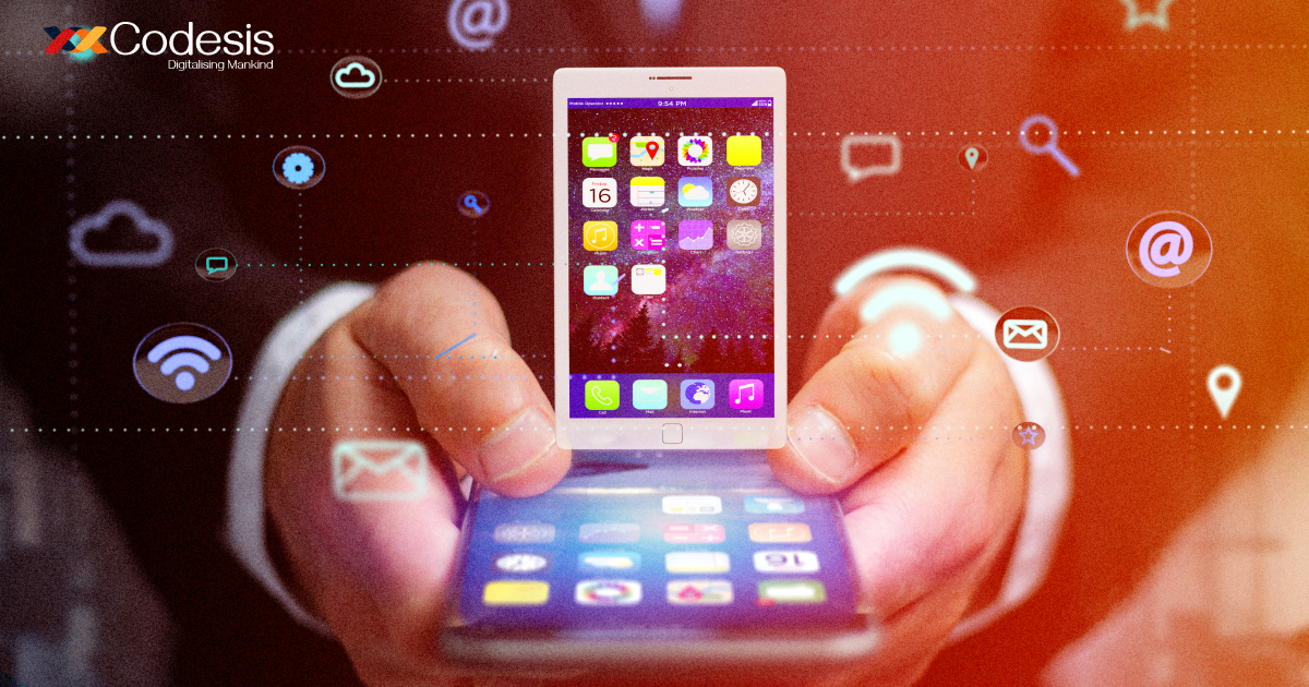 Image of a person holding mobile phone in hand and different app icons emerging from it