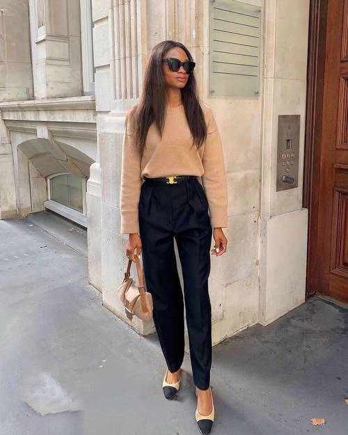 Picture of a lady rocking the celine belt with top and trousers 