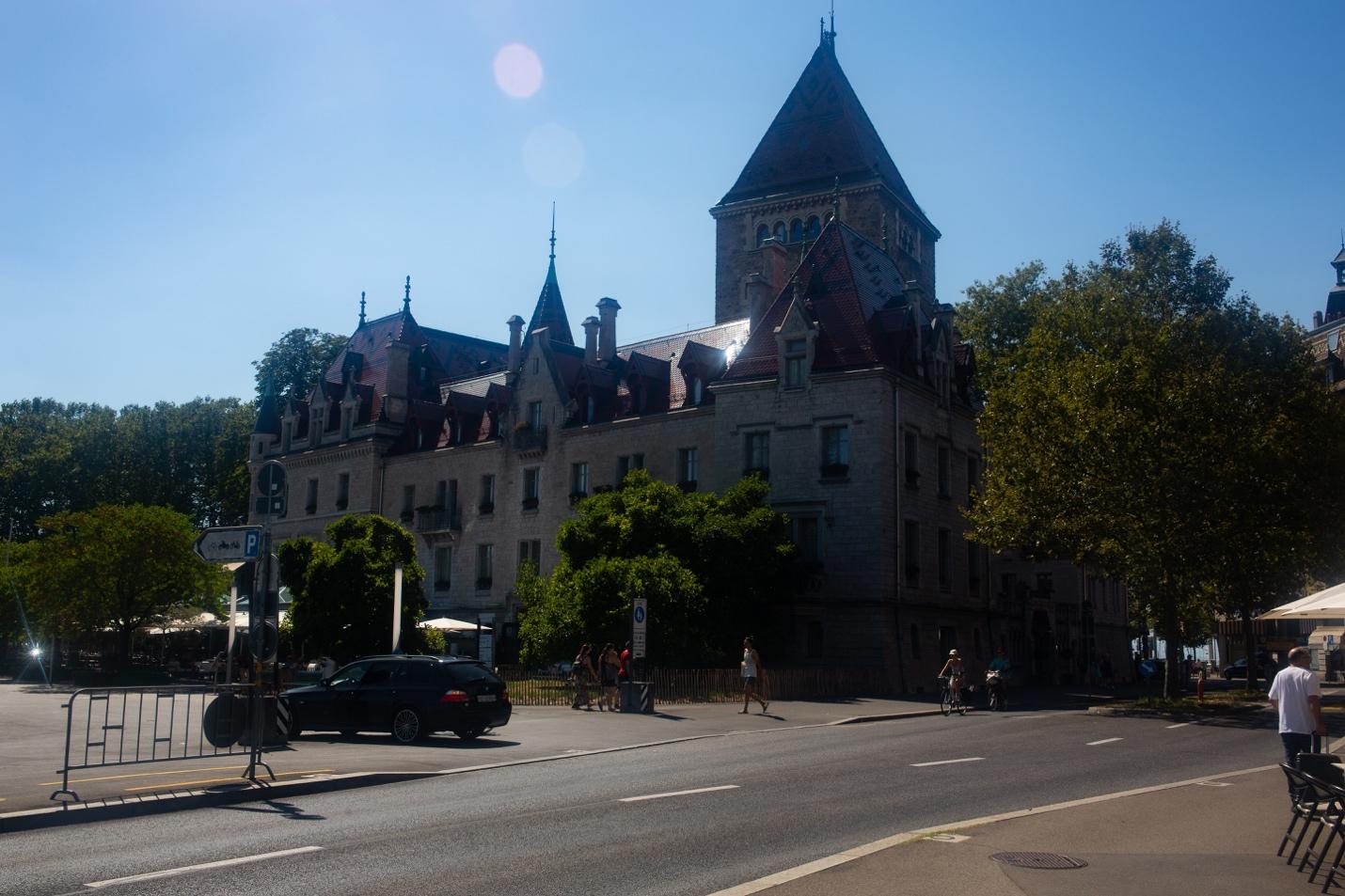 A building with a steeple and trees

Description automatically generated